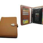 tan color organizer in PU leather with silver clip and calculator inside