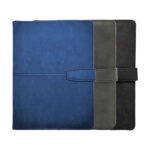 Three colored leather planners stacked together