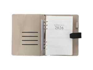 Open 2026 business diary with beige cover.