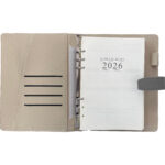 Open business diary for 2026 with brown cover.