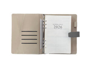 Open business diary for 2026 with brown cover.