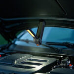 Car engine illuminated by portable LED light