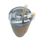 White tumbler with clear lid and straw.