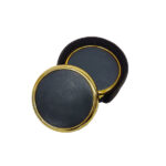 Black and gold round leather box on white background.