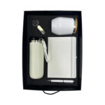 Gift set with tumbler, notebook, pen, keychain.