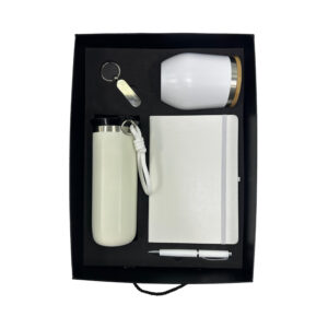 Gift set with tumbler, notebook, pen, keychain.
