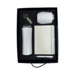 Gift set with tumbler, notebook, pen, keychain.