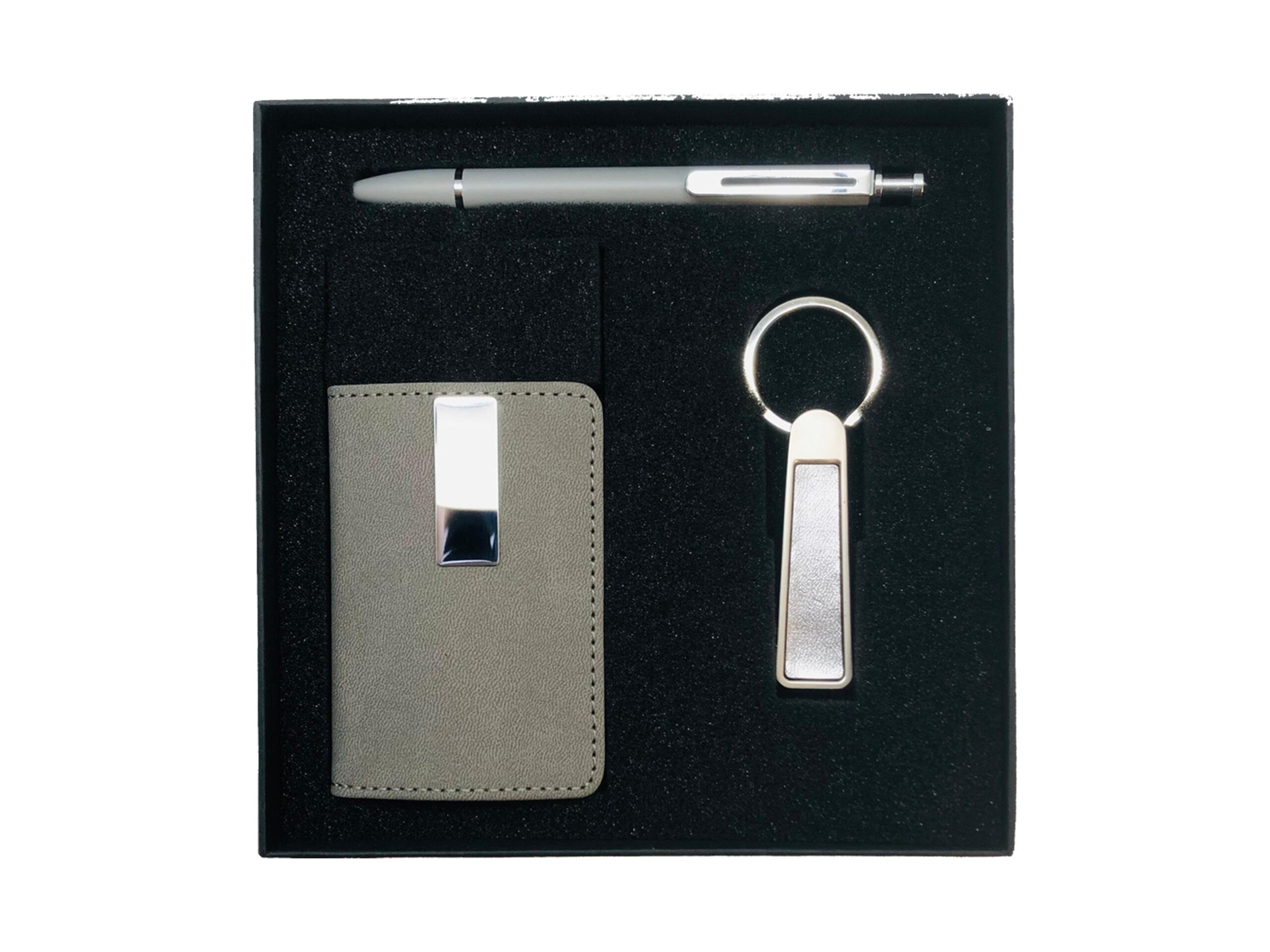 Gift set with pen, keychain, card holder.