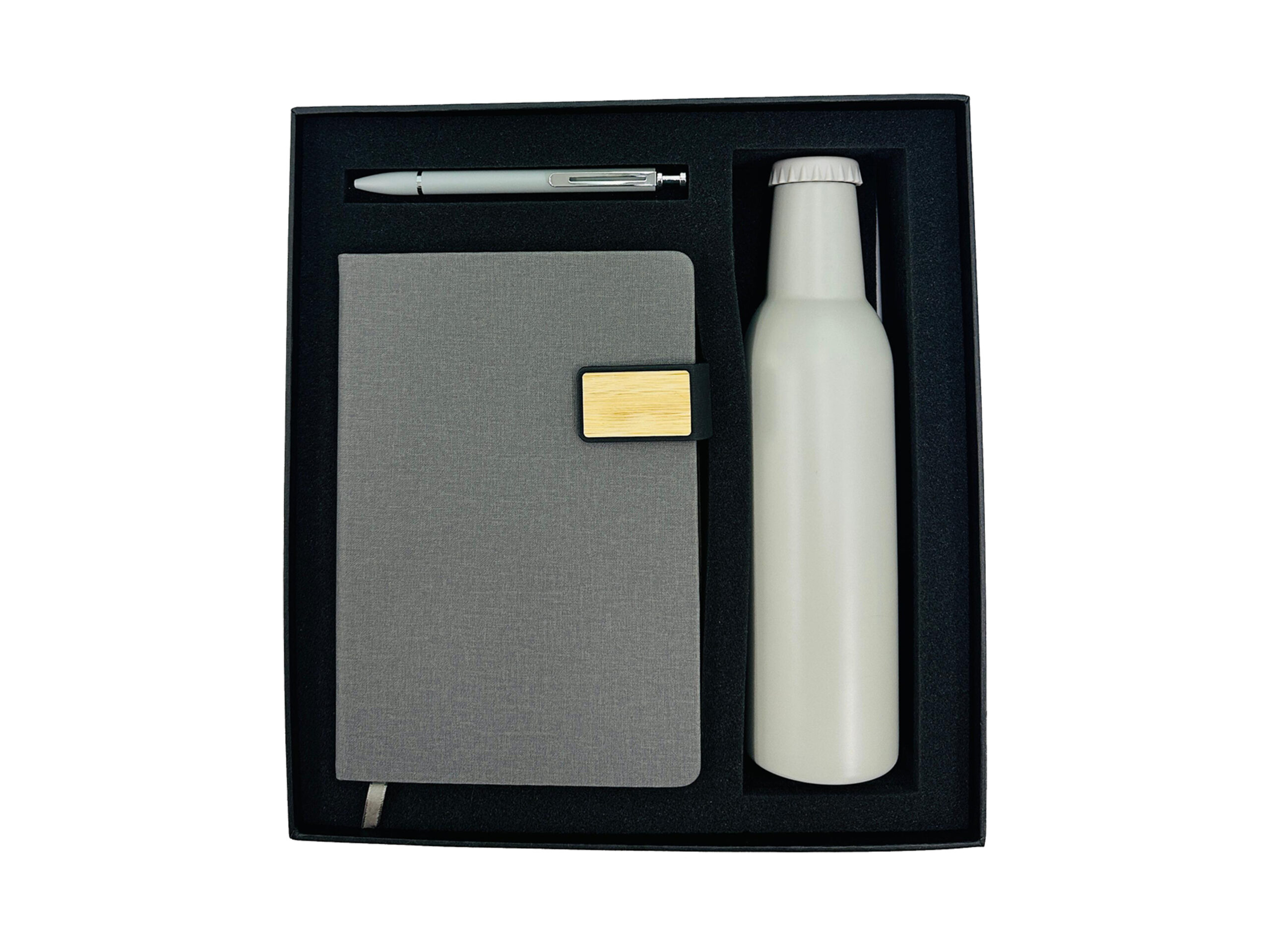 Gift set with notebook, pen, and bottle.