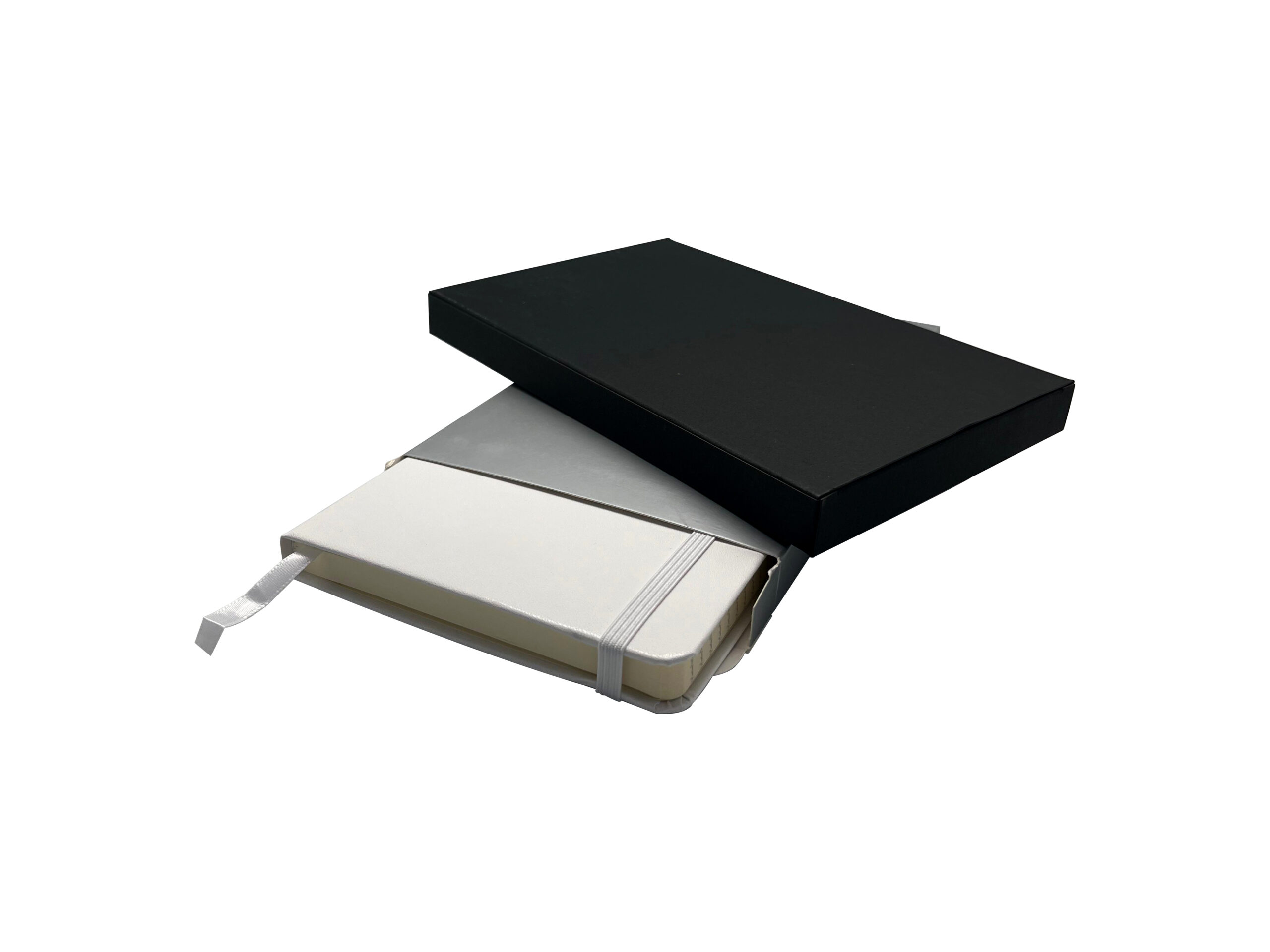 White notebook in black box with ribbon bookmark.