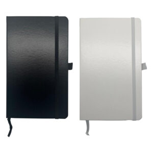 Black and white closed notebooks with elastic bands