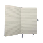 Open lined notebook with white ribbon bookmark