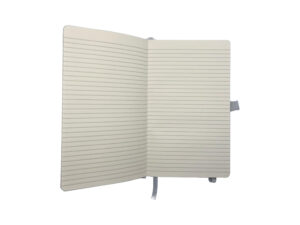 Open lined notebook with white ribbon bookmark