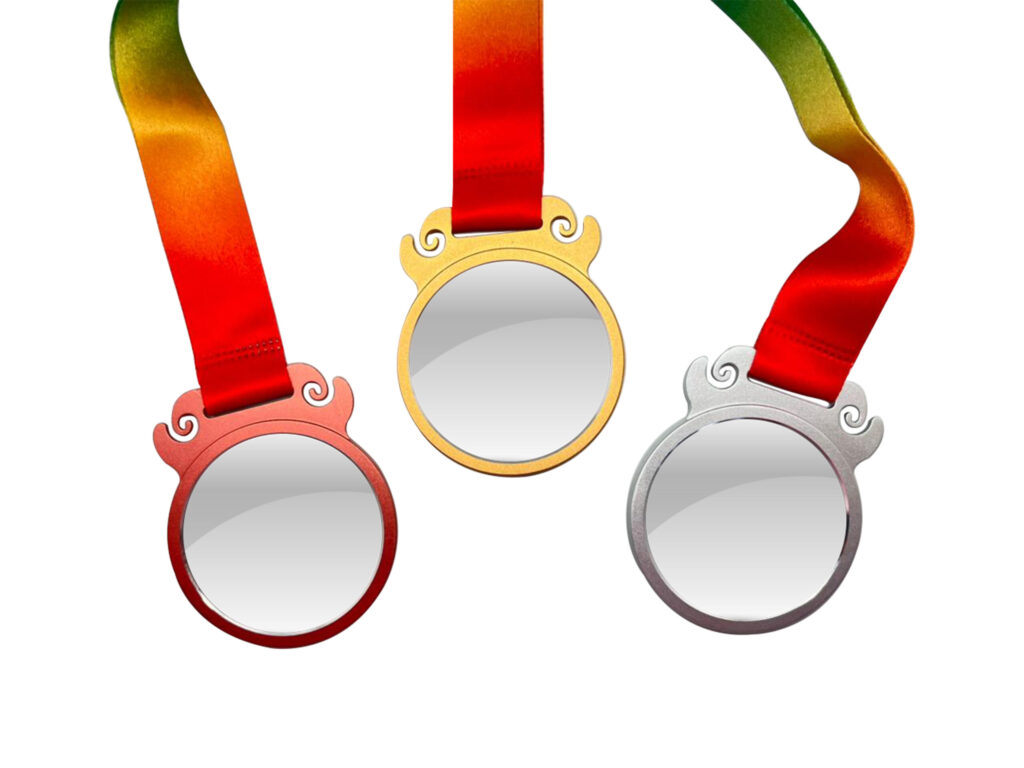 Gold, silver, bronze medals on rainbow ribbons