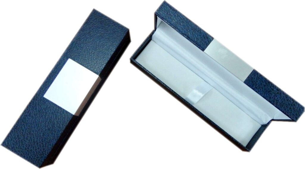 Open navy pen gift box with white interior.