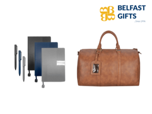 Assorted notebooks, pens, and leather weekender bag.