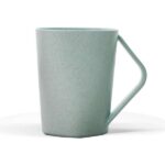 Green ceramic mug with a handle