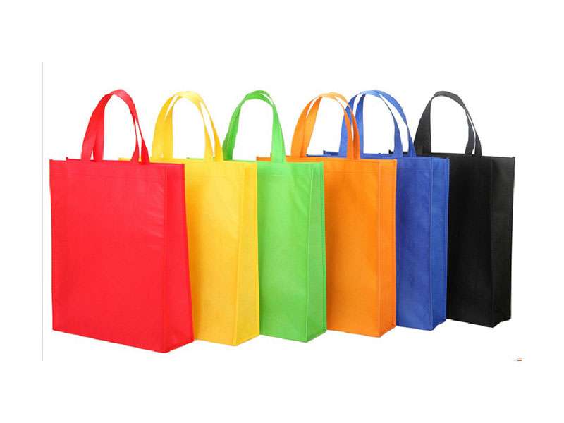 Colorful reusable shopping bags lined up