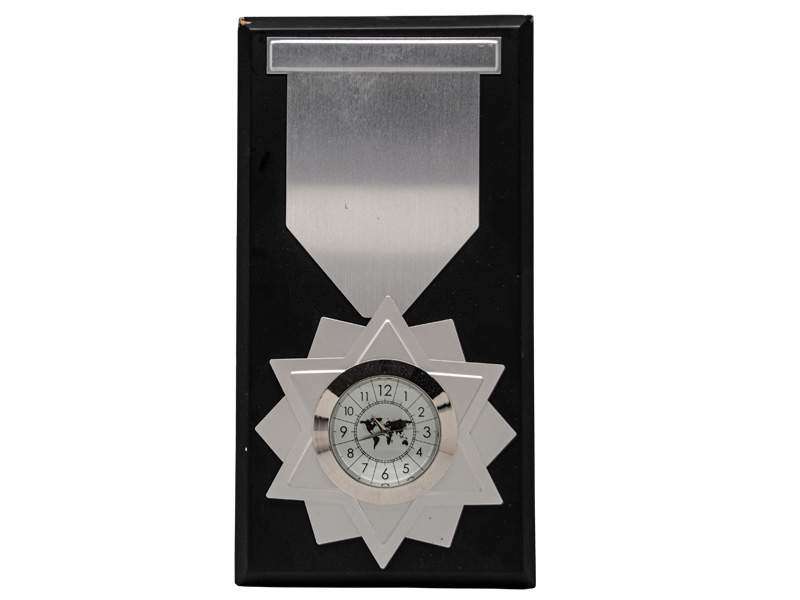Star-shaped clock award with metal plaque.