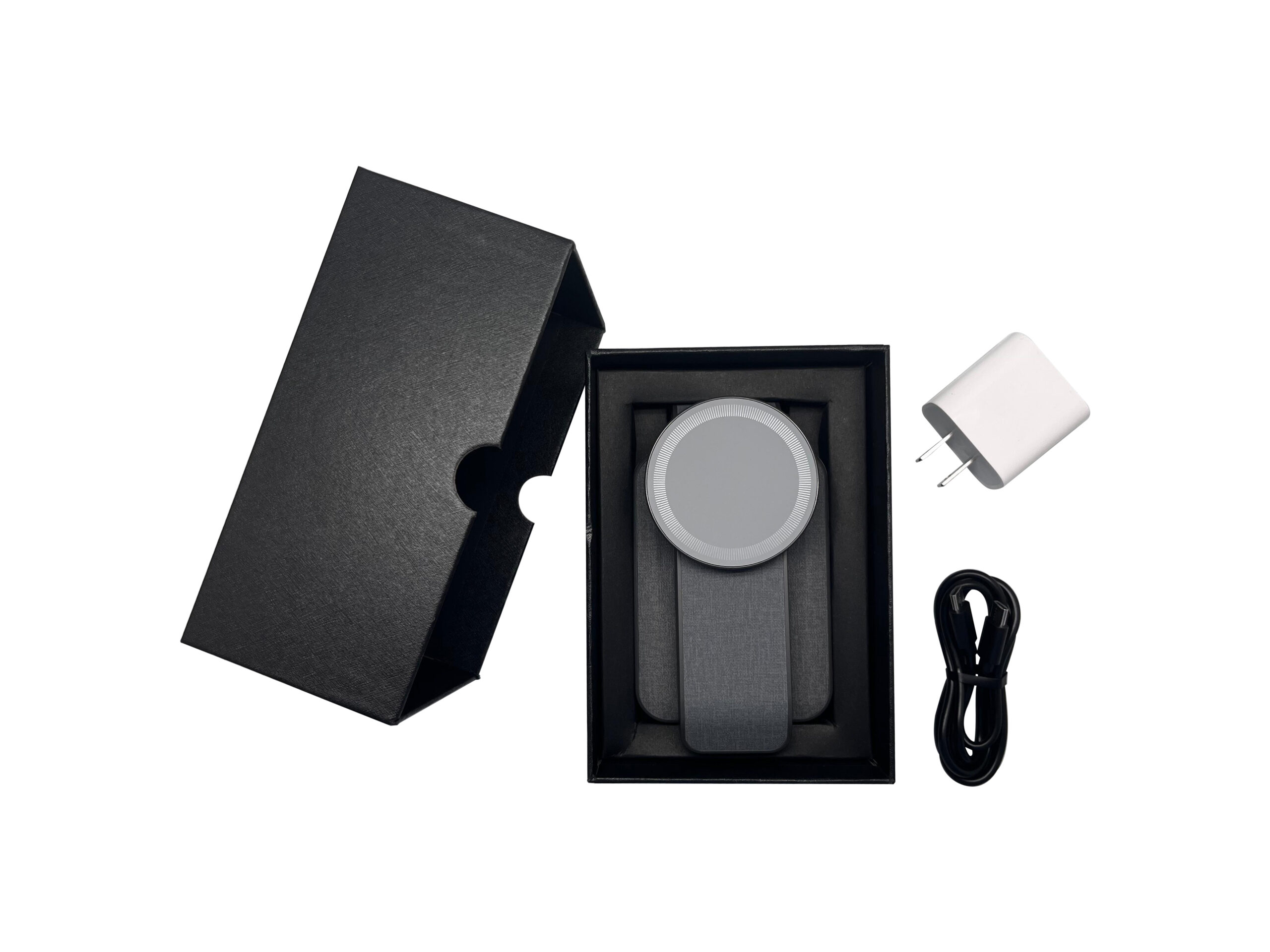 Wireless charger with box, adapter, and cable.