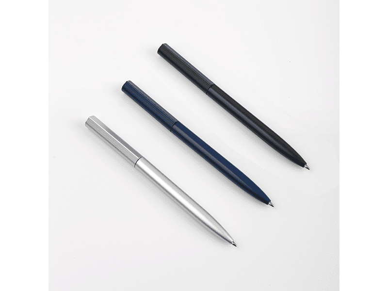 Three ballpoint pens in different colors.