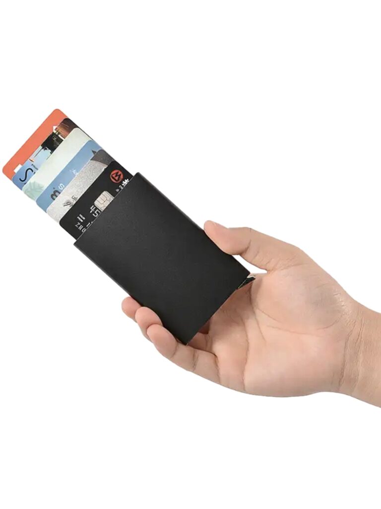 Hand holding wallet with credit cards visible