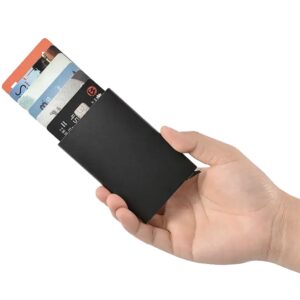 Hand holding wallet with credit cards visible