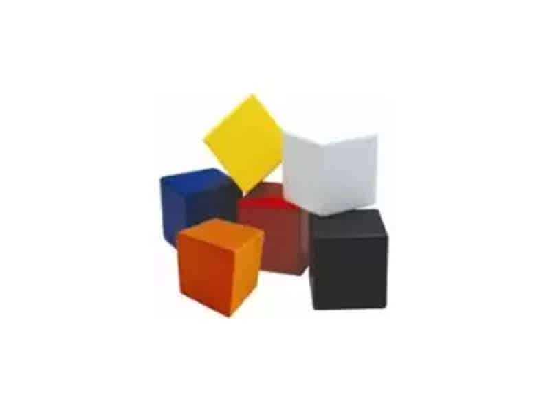 Colorful cubes stacked creatively on white background.