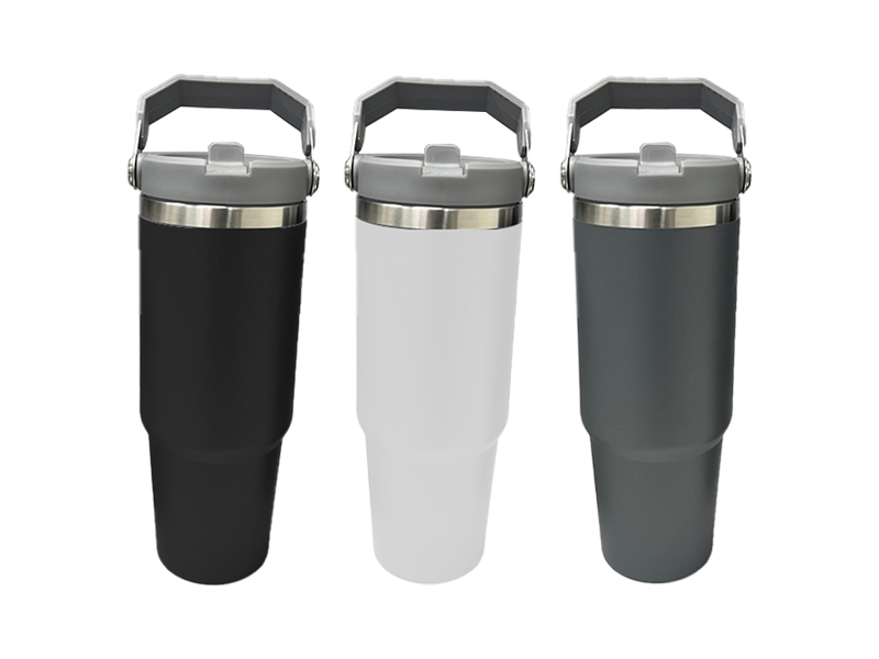 Three insulated tumblers: black, white, and gray.