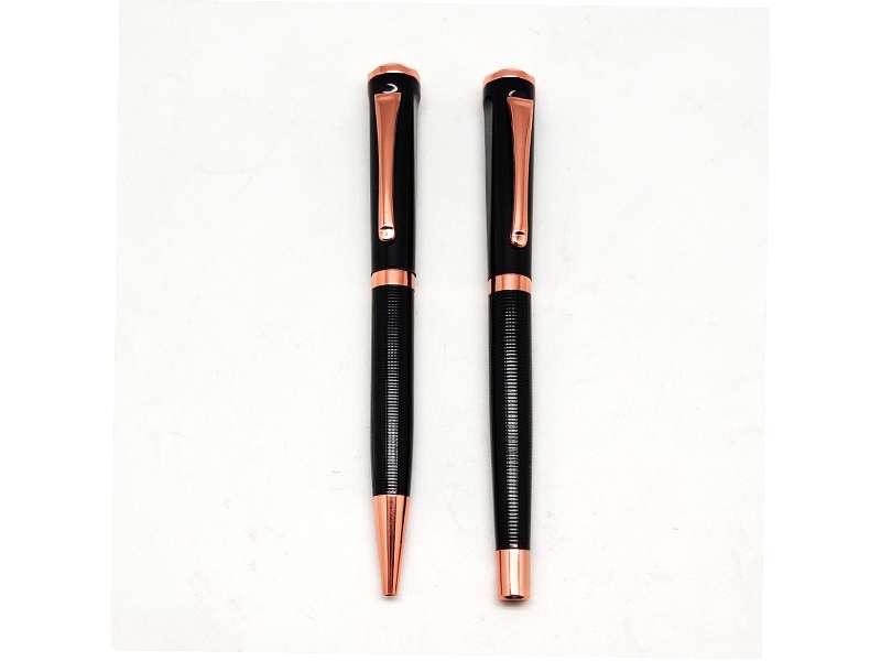 Black and gold pen set on white background.