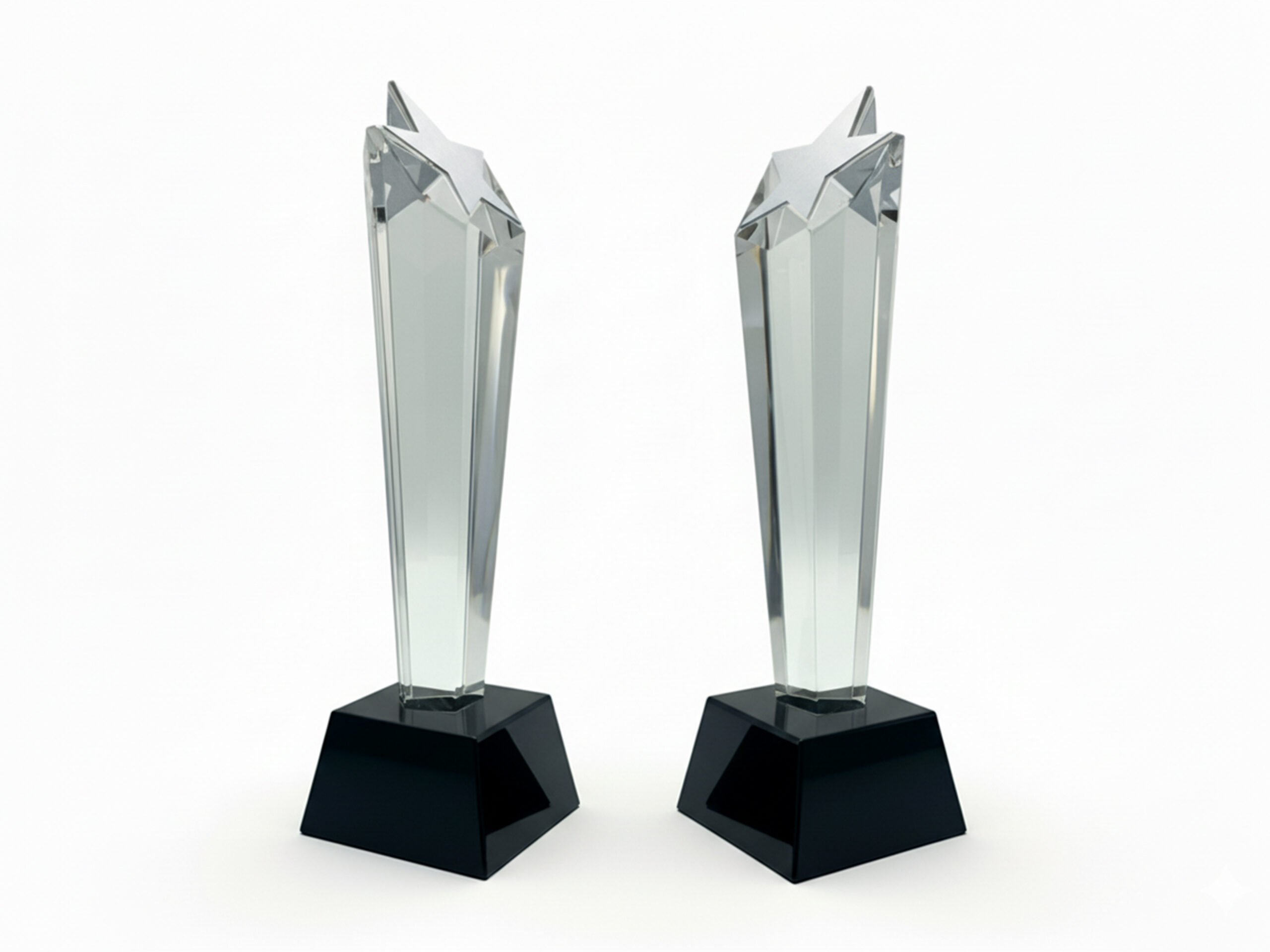 Two star-shaped silver trophies on display