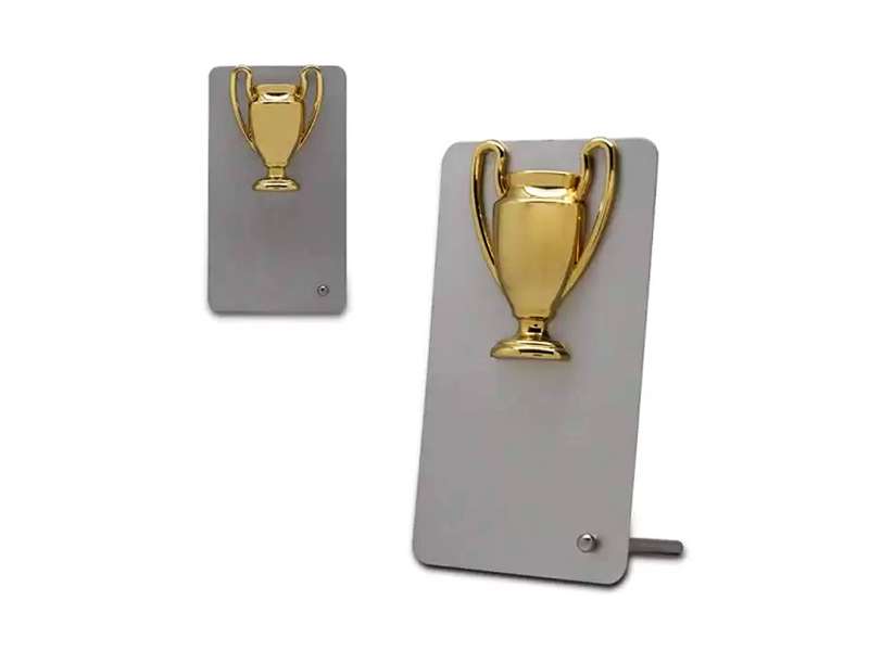 Two golden trophy-shaped desk bells