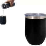 Pouring water into black tumbler with lid
