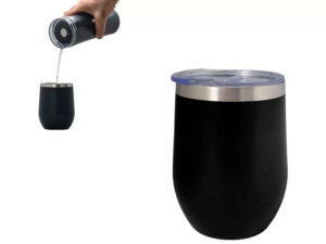 Pouring water into black tumbler with lid